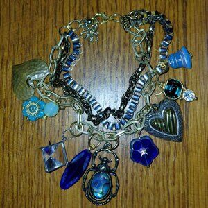 Tri tone charm bracelet glass metal charms flower bell pyramid hearts scarab